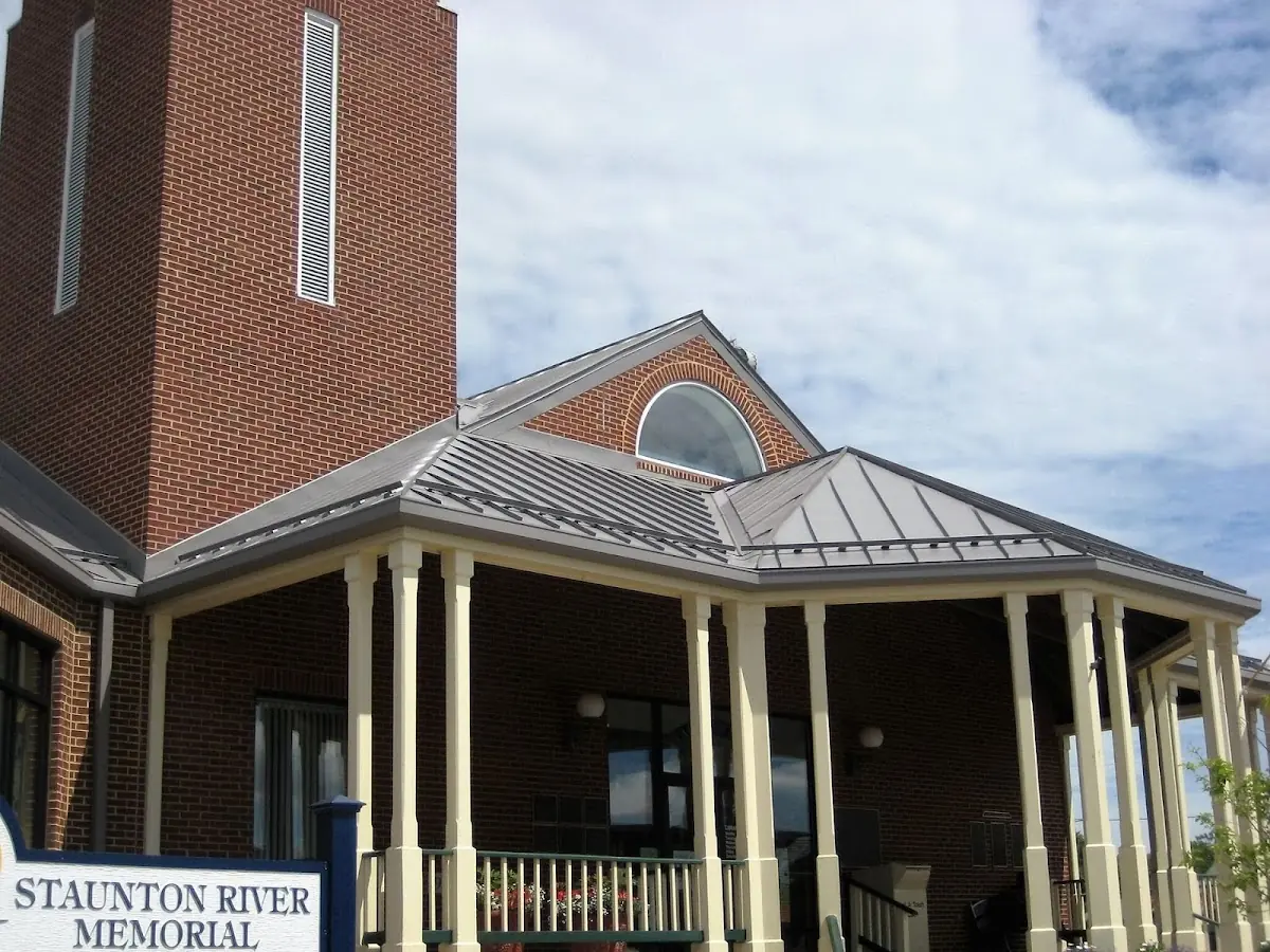 Skilled roofing craftsmen working on a residential roof in High Point